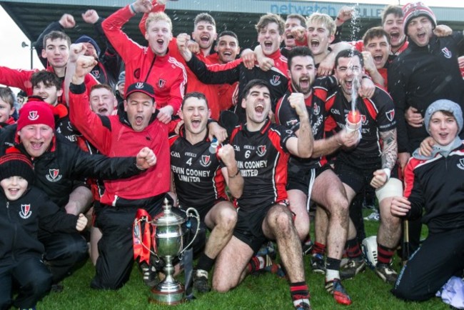 Frank Flannery and players celebrate with the cup