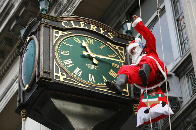 Santa abseils past Clery's Clock