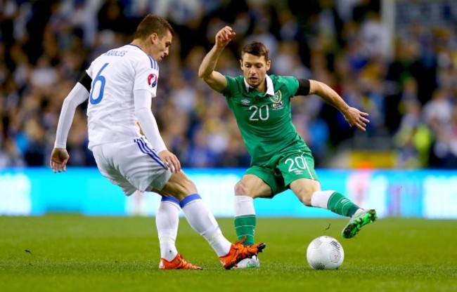 Wes Hoolahan with Ognjen Vranjes