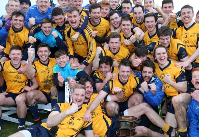 DCU players celebrate with the cup