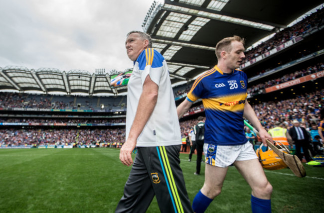 Eamon OÕShea and Lar Corbett dejected after the game