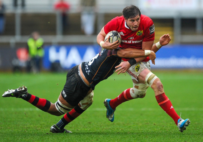 Dave O'Callaghan is tackled by Taulupe Faletau