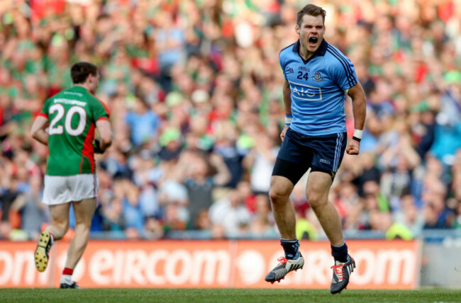 Kevin McManamon celebrates scoring his side's third goal