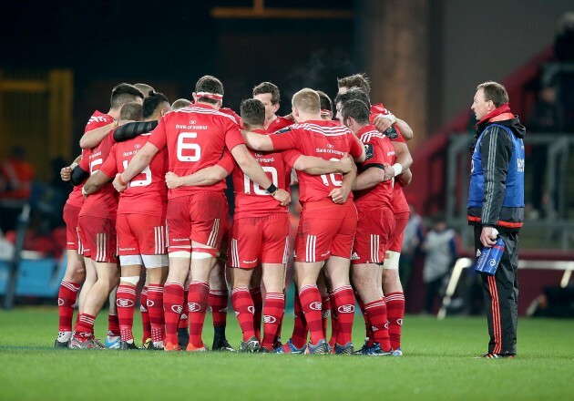 Munster players out early for the second half in a huddle