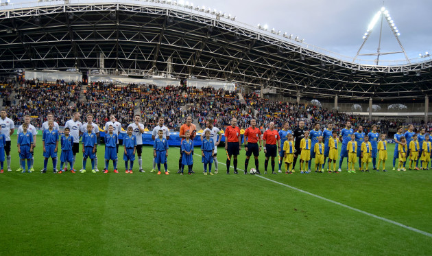 The two teams line up before the match