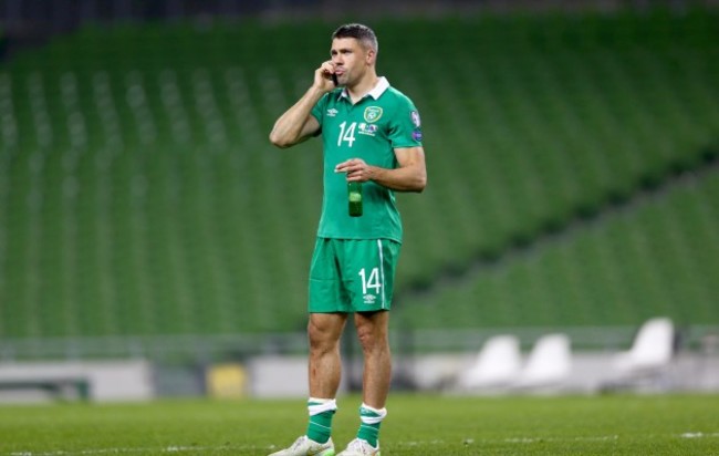 Jonathan Walters makes a phone call in an empty Aviva Stadium