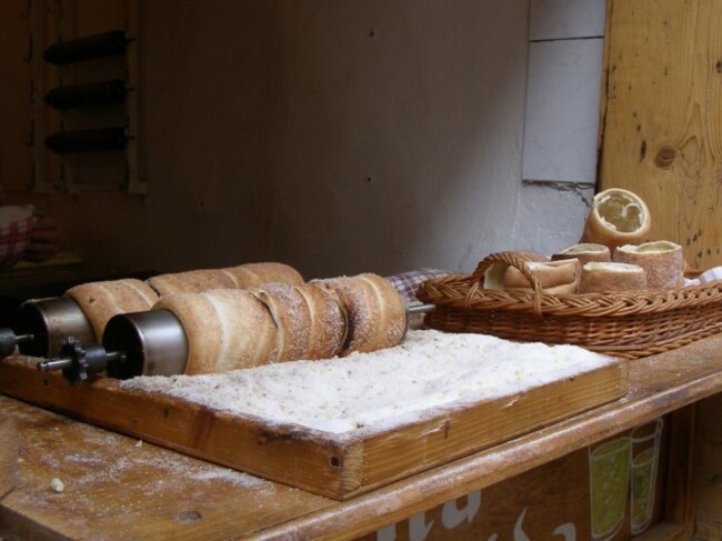 czech-republic-wander-around-any-holiday-market-in-prague-and-youll-be-sure-to-find-a-stand-that-sells-trdelnik-or-chimney-cakes-dough-strips-are-covered-with-sugar-cinnamon-and-nuts-and-baked-wrapped-around-a-cylinder