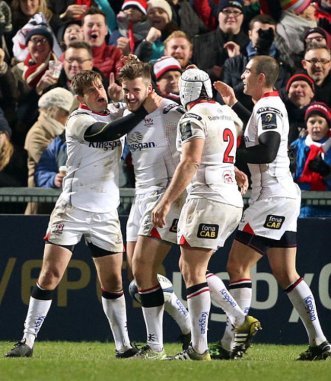 Stuart McCloskey celebrates scoring a try with teammates