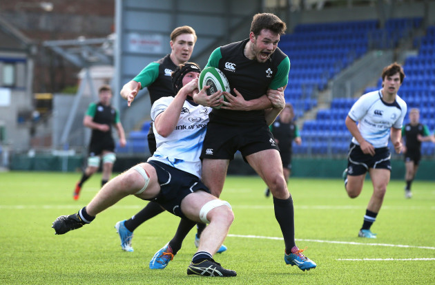 Matthew Byrne is tackled by Tom Treacy