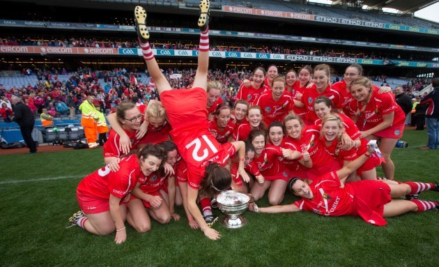 Cork celebrate with the O'Duffy Cup after the game
