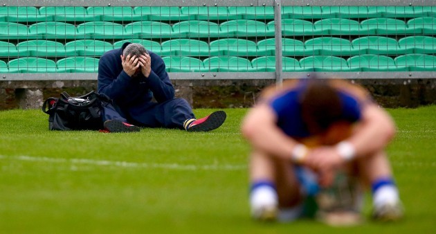 A local Saint Rynagh's photographer dejected at the end of the game