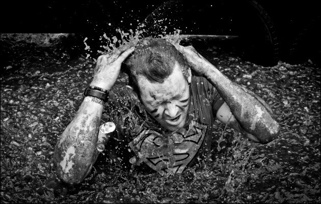 Pictured today is Samuel Smith battling it through the gruelling obstacles at the Tough Mudder event
