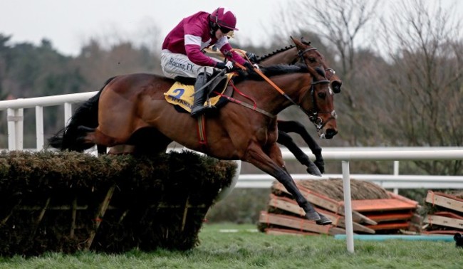 Identity Thief ridden by Bryan Cooper and Nichols Canyon ridden by Ruby Walsh approach the last fence