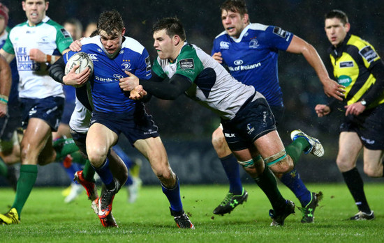 Garry Ringrose tackled by Kieran Marmion and Jake Heenan