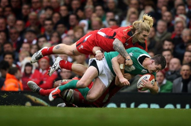 Jonathan Sexton tackled by Richard Hibbard