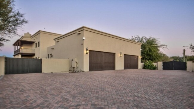 its-a-gated-estate-with-room-for-six-cars-in-its-huge-garage