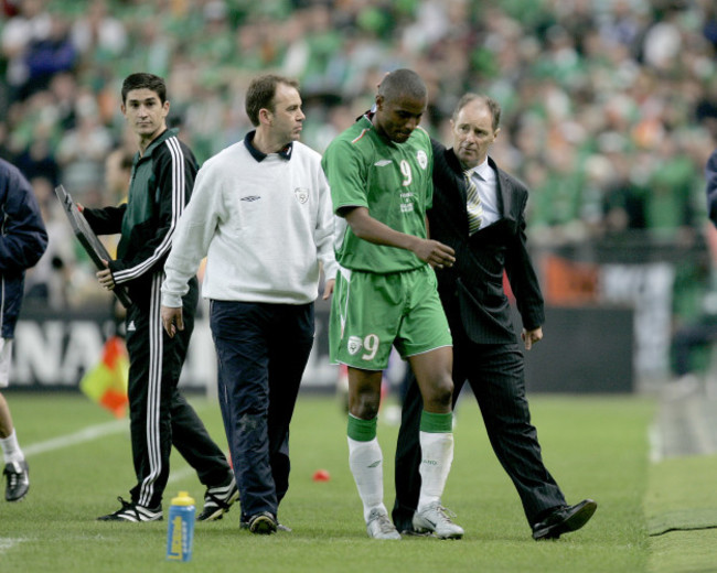 Clinton Morrison is consoled by Brian Kerr