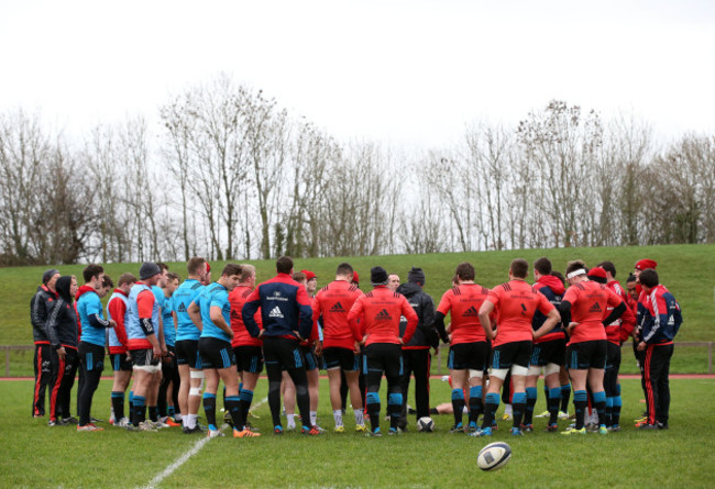 Ian Costello speaks to the players during training