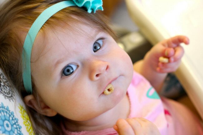 Baby girl and Cheerios