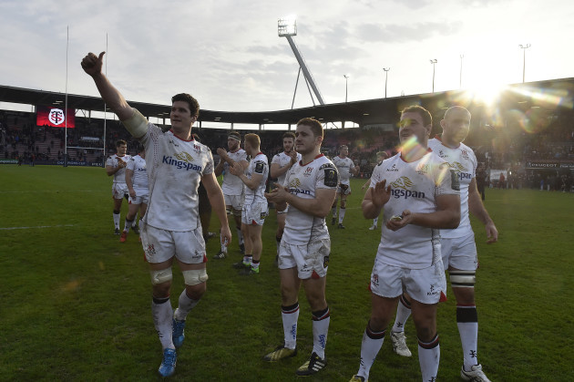 Ulster players celebrate winning and salute their fans