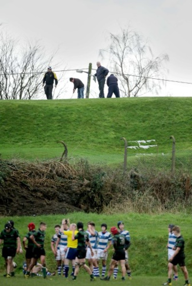 Golfers from a nearby course watch the game between Rockwell and Bandon