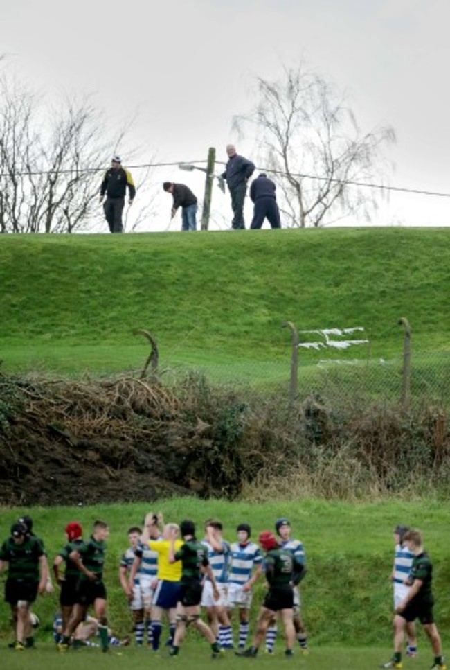 Golfers from a nearby course watch the game between Rockwell and Bandon