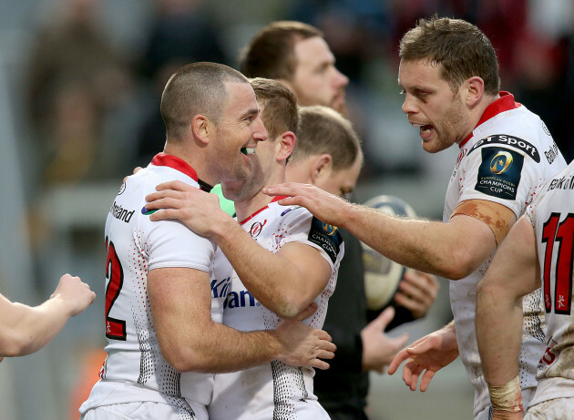 Ian Humphreys celebrates his try with teammates