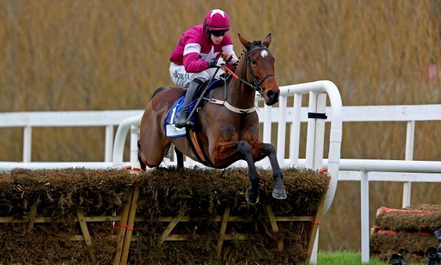 A Thoi Phil ridden by Bryan Cooper clears the last on the way to winning