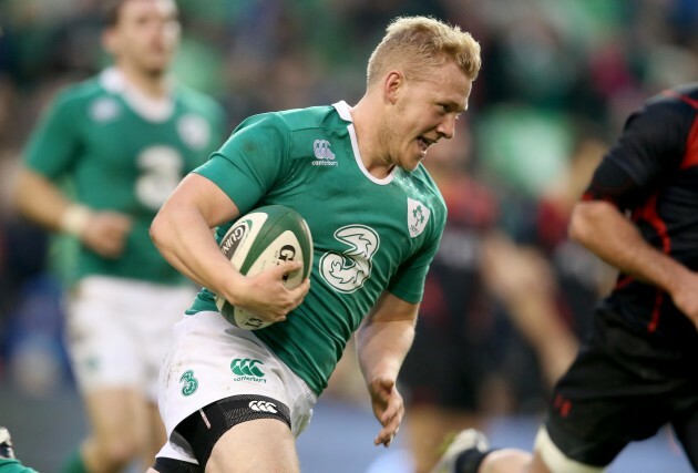 Stuart Olding runs in for a try