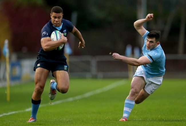 Adam Byrne skips past Steve McMahon on his way to scoring their first try of the game