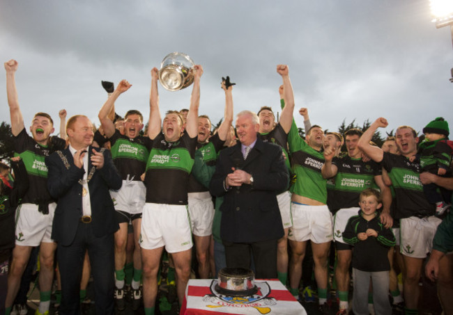 Paul Kerrigan lifts the trophy