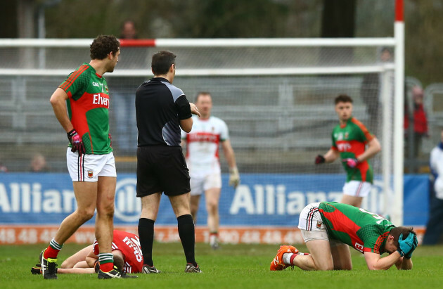 Eoin Cadogan and Lee Keegan following a head collision