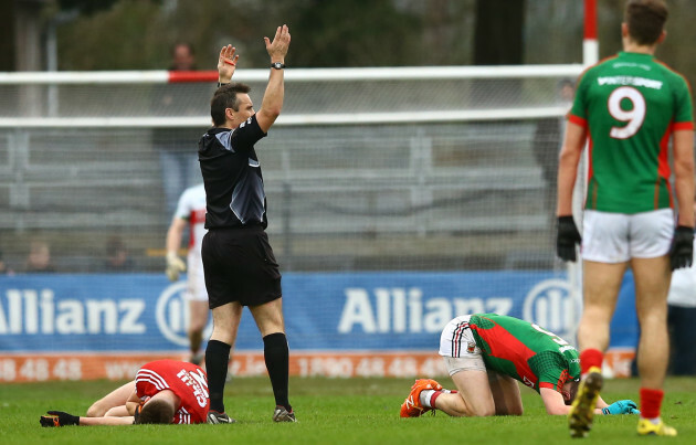 Eoin Cadogan and Lee Keegan following a head collision