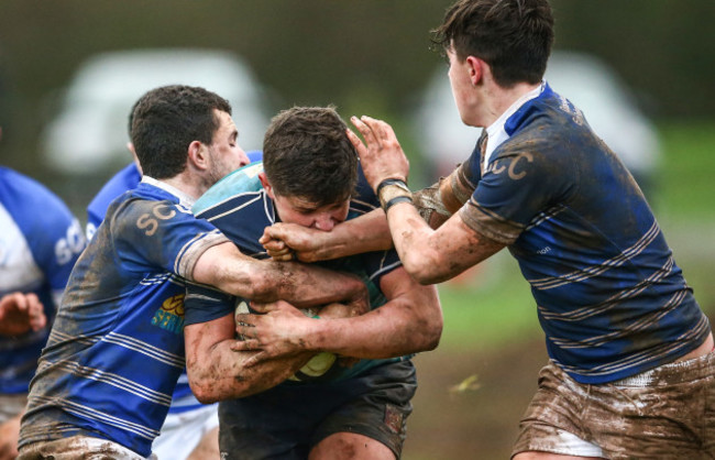 Eoin Murnane and Aidan Quinlavan tackle Joseph Conway