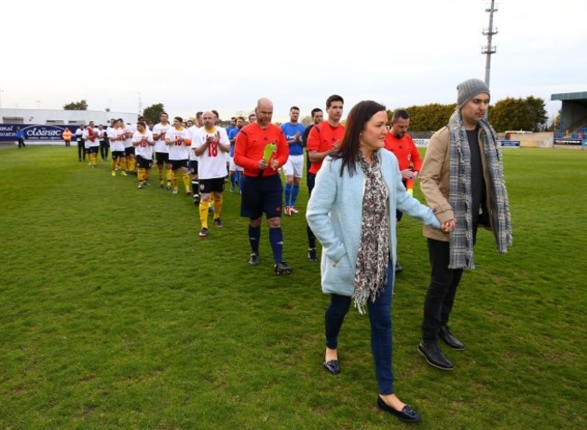 Mark Farren and his wife Terri-Louise lead out Glenavon and Derry City select teams