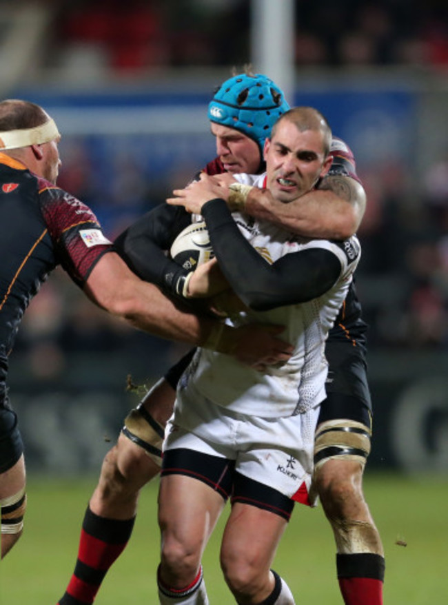 Ruan Pienaar is tackled by Ben White