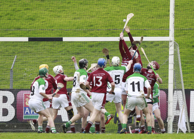 Cushendall players try to prevent a Sarsfields goal