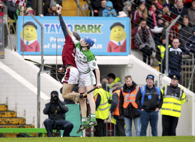 Karl McKeegan beats Niall Morrissey to the ball