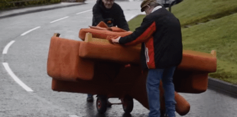 A Video Of Two Tyrone Fellas Struggling To Move A Couch Down A