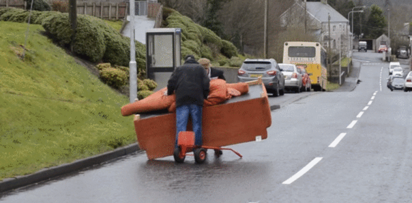A Video Of Two Tyrone Fellas Struggling To Move A Couch Down A