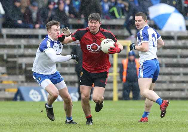 Connaire Harrison gets away from Fintan Kelly and Dermot Malone