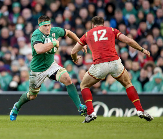 CJ Stander runs at Jamie Roberts