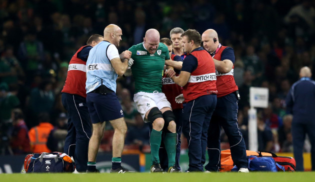 Paul O'Connell tries to get to his feet before being stretchered off the field