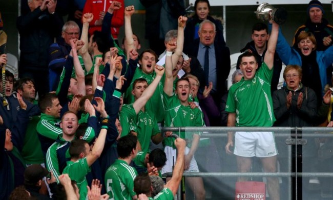 Brian Carroll lifts the cup