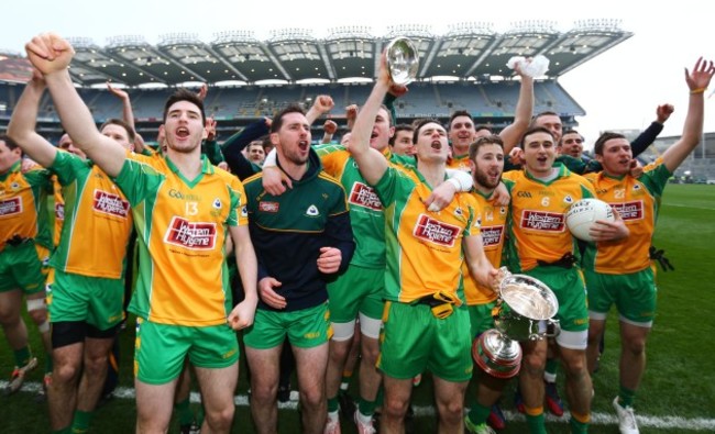 Corofin players celebrate with the cup after the game