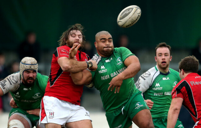 Rodney Ah You supported by Mick Kearney and Shane OÕLeary as he is tackled by Dave Ryan