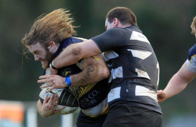 Dave Ryan of Dolphin tackled by Vinny Soden