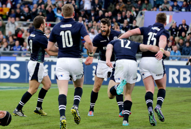 Scotland players celebrate a late Tommy Seymour try