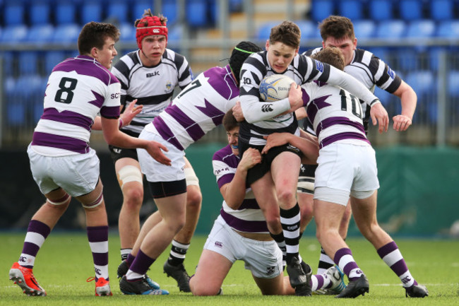 Alan Tynan is tackled by Thomas Monaghan