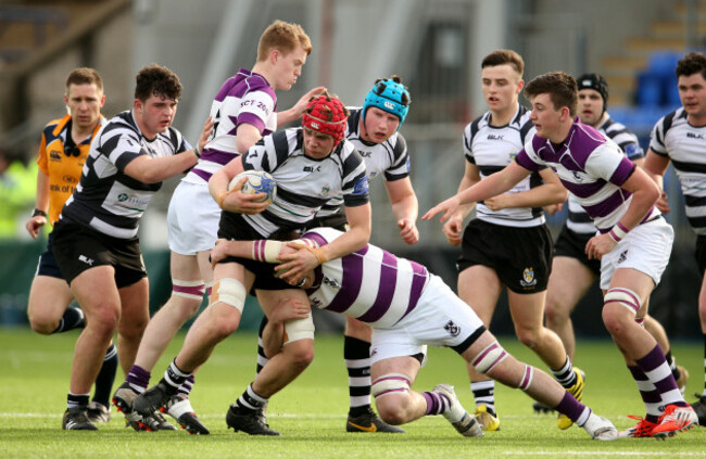 Jack Canning is tackled by Florence McCarthy